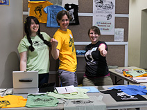 Holly Seyler, Renske Kirchholtes, and Jenny Hofmeister at the tee-shirt table