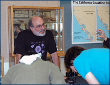 Ken Finger shows visitors California foraminiferans, past and present