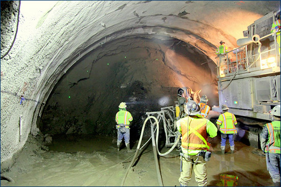 Workmen drilling a fourth bore of the Caldecott Tunnel