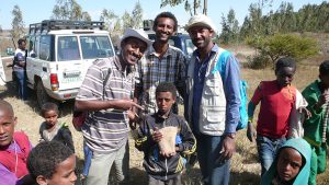 Million Alameyeho & Samuel Getachew (Addis Ababa U.) and Tadesse Berhanu (Oklahoma State U,) with local school kids 