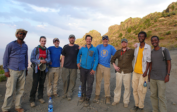 Group pic at the top of the flood basalts that cap the steep sided canyons of the Blue Nile Gorge, near Fiche, Ethiopia. From L to R: Tadesse Berhanu (PhD student, Oklahoma State); Connie Rasmussin (PhD student, Utah); Keegan Melstrom, PhD student, Utah); Randy Irmis (Utah); Greg Wilson (Washington); Mark Goodwin (UCMP); Dave Demar (Postdoc, Washington); Million Mengesha and Samuel (Earth Sciences Dept., Addis Ababa University).