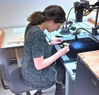 Meschelle carefully preparing type specimens for their photo session. 