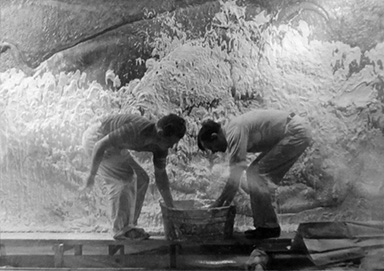 Huff and an assistant prepare the plaster mold for the bas-relief