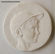 Boy with cap medallion
