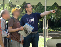 Dave Smith, Cal Day coordinator for UCMP, points the way