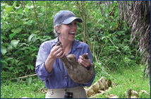 Judy with a sloth in the Amazon jungle near Iquitos, Peru