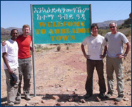 Chalachew Mesfin, Randy Irmis, Greg Wilson and Mark Goodwin outside of Abi Adi, Ethiopia