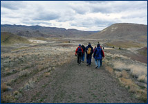 UCMP graduate students hike through the Painted Hills unit