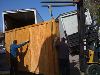 Loading the crated bas-relief for its journey to the Regatta storage facility